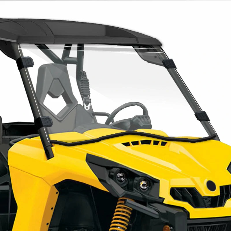 Close-up view of a StarknightMT polycarbonate windshield installed on a Can-Am Commander UTV with visible steering and suspension details.