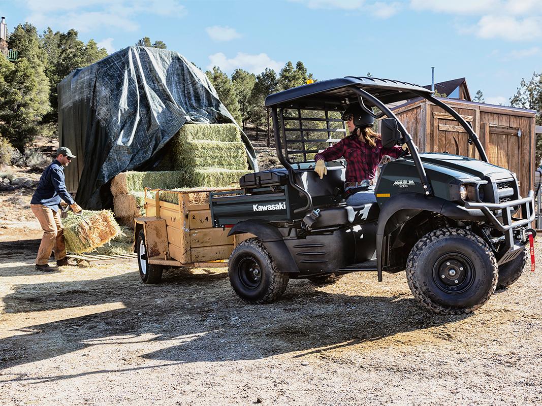 KAWASAKI Mule transporting hay bales on the farm