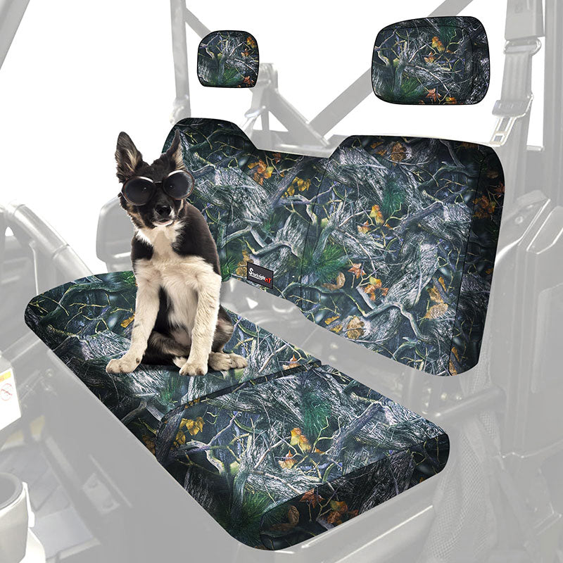 Dog wearing sunglasses on camo seat covers in Polaris Ranger XP 1000, highlighting scratch-resistant and water-repellent features